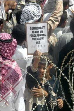 253_Iraq_kid_holding_sign.jpg